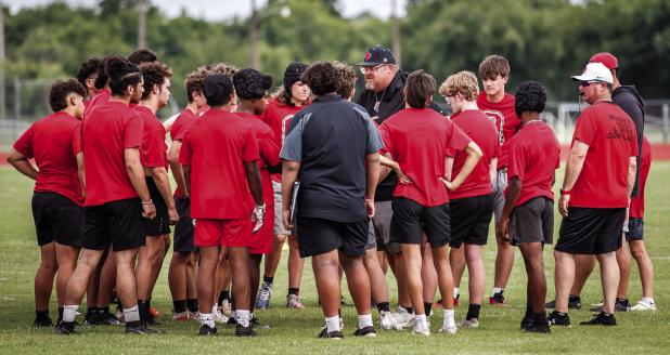 Olney ISD Athletic Director and Head Cub Football Coach Chris Tobola gives a pep talk during the recent player-led 7-on-7 game against Munday. Photo by Will Sadler