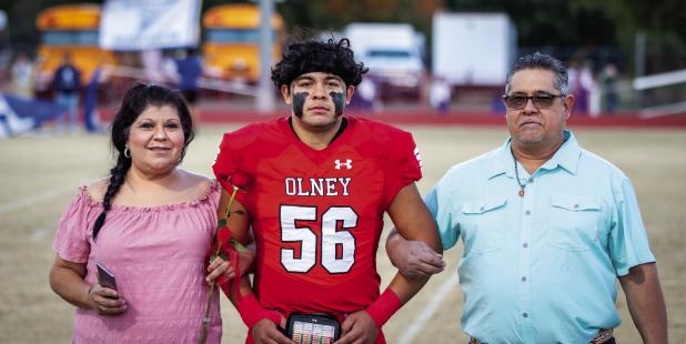 OHS Cubs #56 Noah Enriquez was escorted by Ruby and Malaquias Enriquez. Noah played right tackle and defensive end for the Cubs for 4 years.