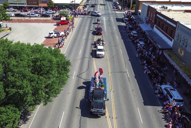 With reportedly over a 1,000 parade attendees it called for a new strategy for parade participants to make their way around the square, but Graham pulled it off without a hitch. Photo by Will Sadler