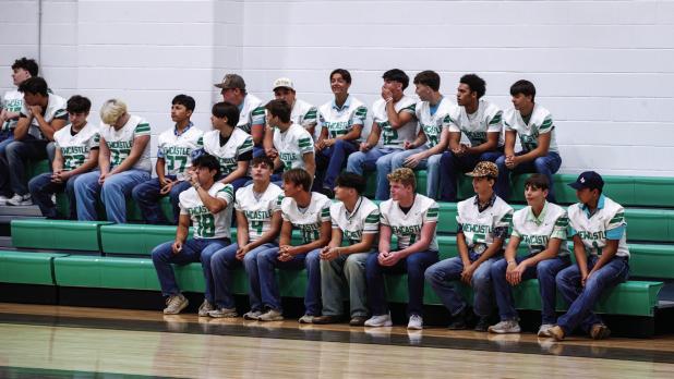 Bobcat football players chat excitedly after being announced and taking their walk through the Bobcat tunnel. Photo by Will Sadler
