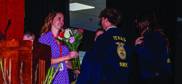 OHS FFA Ag Teacher Haylee Haralson received flowers and a special video presentation marking the end of her journey in the FFA and moving on to become the principal for Olney High School beginning next school year. Photo by Will Sadler