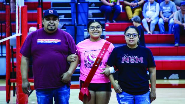 Lady Cub and HOCO Queen #10 Allison Alvarado escorted by parents Vico Alvarado and Dolores Godinez during Senior Night. Photo by Will Sadler
