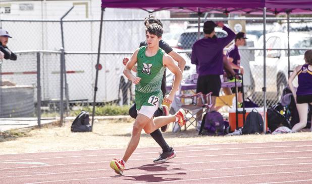 NHS Bobcat Tristan Schultz moves on to Regionals in 400m and 800m run. Photo by Will Sadler