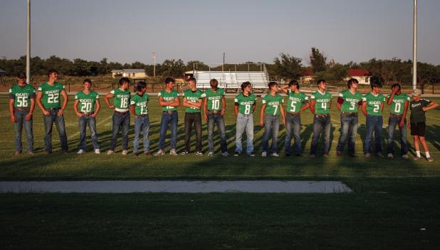 The Newcastle ISD Bobcat football team is announced during the annual Booster Bash. Photo by Will Sadler