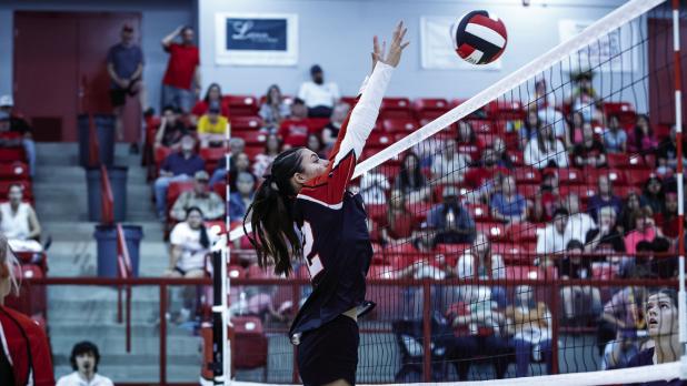 Lady Cub #12 Halee Craven goes up for one of many blocks at the net during the Lady Pirates match. | Photo by Will Sadler