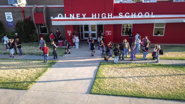Olney High School Students wait for the first bell of the new school year to ring. Photo by Will Sadler
