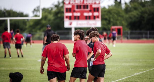 Varsity Cubs anxiously wait their turn to take the field during the Munday touch football game. Photo by Will Sadler