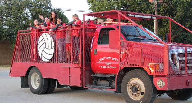 Olney’s Lady Cubs Volleyball players catch a ride on an Olney Volunteer Fire Department truck to the Sept. 16 Homecoming pep rally at Cub Stadium. Photo by Kailyn Altmiller