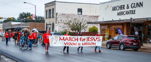 The 28th March for Jesus went off as planned on Oct. 4, despite a steady drizzle. Marchers headed down Main Street to the First Baptist Church of Olney for worship, luncheon, and prize giveaways. Photo by Will Sadler