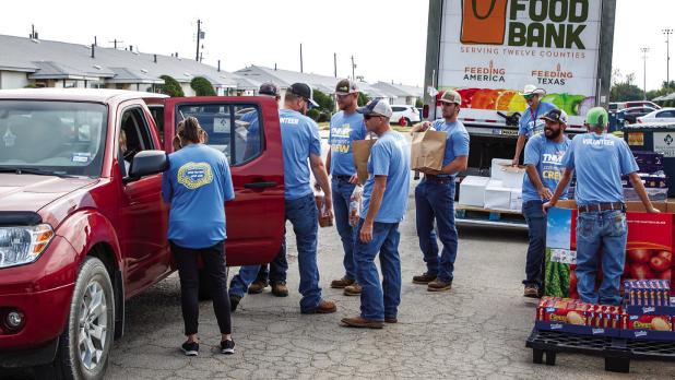 Volunteers with the Ministry of Helps teamed up with Texas New Mexico Power to hand out and deliver much-needed groceries. Photo by Will Sadler