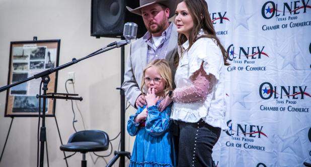 Raylee Cawthon stands with her parents, Ryan and Malia Cawthon, after receiving the Olney Chamber’s award for Volunteer of the Year. Photo by Will Sadler
