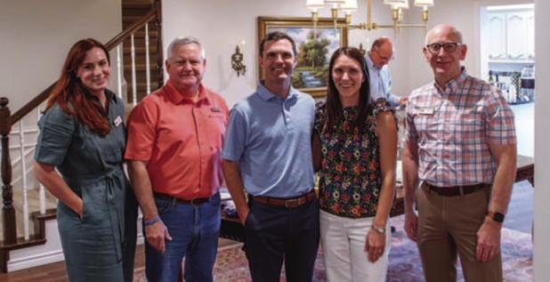 Julie Nawrocki, director of philanthropy for the Wichita Falls Area Food Bank, stands with United Methodist Pastor Harrell Braddock, Olney Mayor Rue Rogers, Anna Rogers, and Food Bank CEO David O’Neil at a reception to inform Olney residents about the F