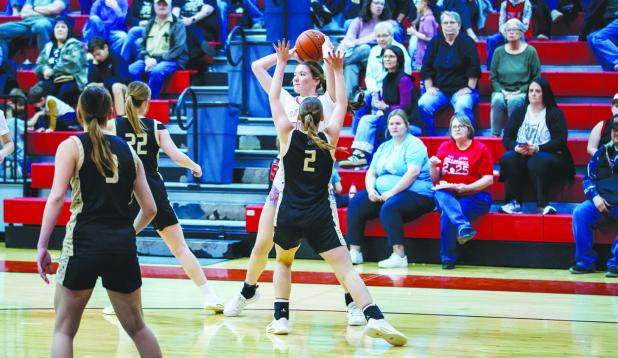 OHS Lady Cubs #10 Kristen Fields and #23 Aubree Englishbee team up against a Ladycat shooter. Photo by Will Sadler