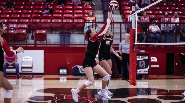 Lady Cub #9-Oaklan Hopkins sends a volley over the net to Lady Trojan defenders. Photo by Will Sadler