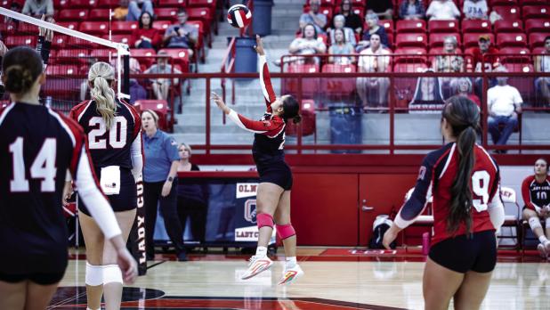 Lady Cub #23 Aubree Englishbee sends a volley across the net towards rival Lady Indian defenders. Photo by Will Sadler