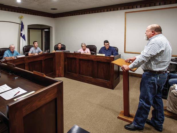 Big Luv’s BBQ Proprietor Barry Hodges asks the Olney City Council to consider new fees for out-of-town food trucks. Photo by Will Sadler