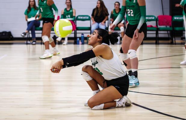 Varsity Ladycats Homecoming Queen Flor Carranza goes in for a save on a kill shot sent over the net by an Eastland Lady Maverick. Photo by Will Sadler