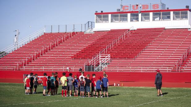 OISD Athletic Director and Head Football Coach Dustin Altmiller goes over camp expectations with attendees of the K-5 grade camp and instills excitement in the day’s activities. Photo by Will Sadler