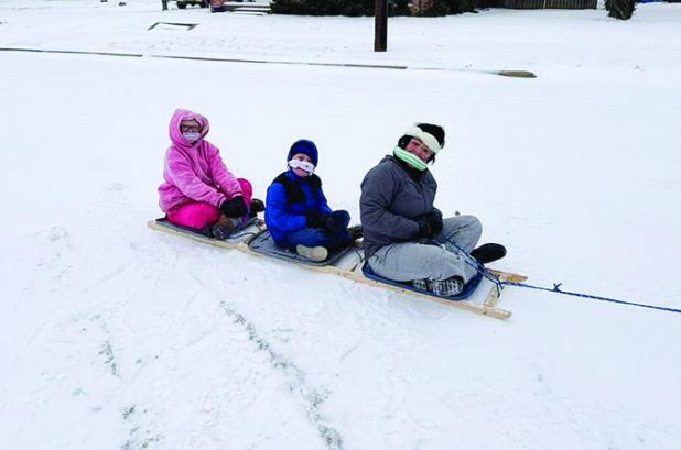 Aubree, Cayleb and Scarlett on their homemade sled