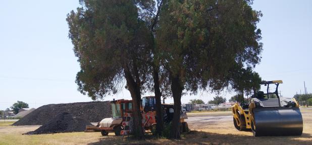 Texas Department of Transportation crews parked their heavy equipment – and a mountain of road material – in the median at State Highway 79 and Avenue C, as work continues on State Highway 114 through Olney. Photo by Gina Keating
