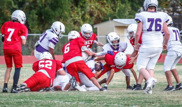 The Cub defense kept the Plowboys quarterback scrambling the whole game and attacked the ball carrier as one unit! Photo by Will Sadler