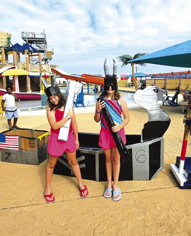 Charlotte and Katherine Garcia show off their prize-winning entry, “The Valkyrie,” which took the prize for “Crowd Favorite.” Photo provided by Chris Garcia