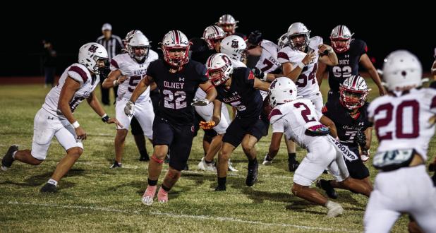 Cub #22 Kyle Stewart blocks and leads the way for #5 Kanton Rodgers DE-RB who runs for yardage, the Cubs saw little success offensively against the Bearcats but the success that came was mainly from the Cubs running game and QB #11 Tucker Cortinez’s scr