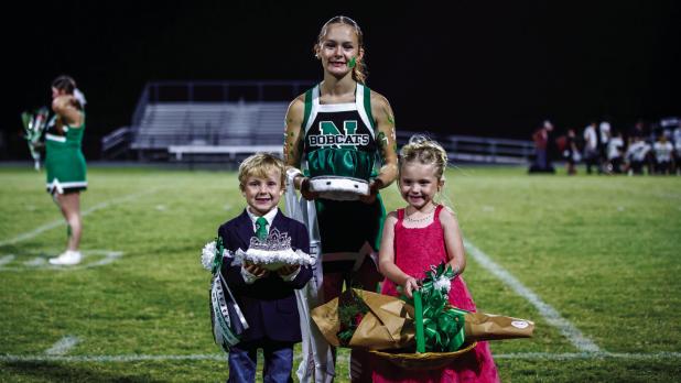 Crown bearer: Casen Jackson and Flower girl: Lottie Hardin with NHS Cheerleader Kourtney Whitfield. Photo by Will Sadler