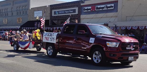 Olney’s Cub Scout Pack 414 led by Chris Garcia was one of several Olney entrants into the Stars and Stripes in Young County parade on the Graham town square on July 4. Olneyites turned out to watch the parade of more than 100 entries and to march in the