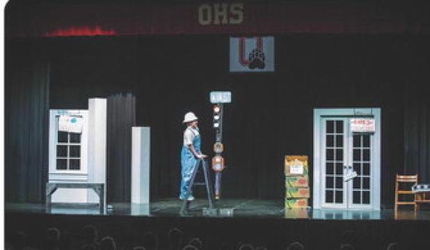 The town’s maintenance worker who periodically works on the titular one stop light becomes the architect for the story, walking characters though the play’s journey. Photo by Will Sadler