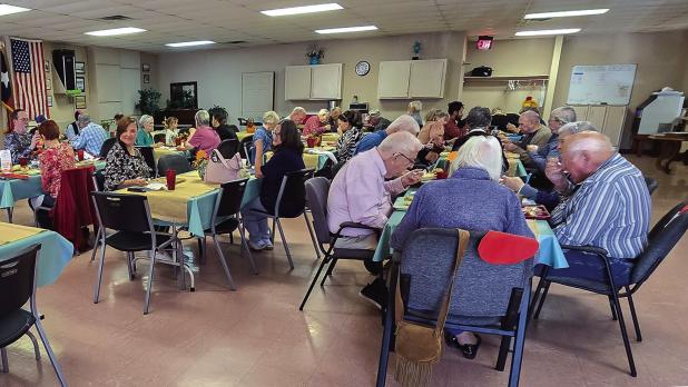 The Cub Center offers delicious holiday meals which include festive fellowship around holidays which may be the only celebration of the holiday some enjoy with others. Shown are community members enjoying a Thanksgiving lunch. Photo by Will Sadler