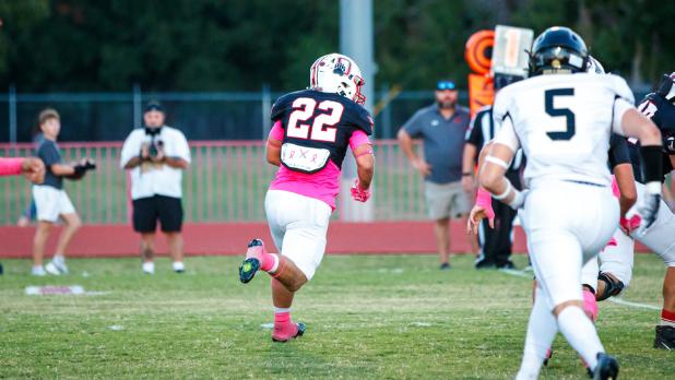 OHS Cub running back #22 Kyle Stewart looks downfield for an opening after the handoff. Photo by Will Sadler