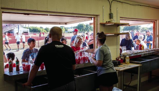 Olney Athletic Booster Club members, OHS coaches, and volunteers are what make special events celebrating OHS Athletes a big success. Meet the Cubs attendees enjoyed free water, watermelon, and hot dogs. Photo by Will Sadler