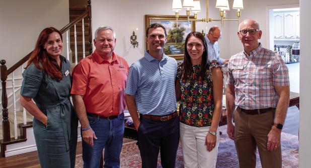 Julie Nawrocki, director of philanthropy for the Wichita Falls Area Food Bank, stands with United Methodist Pastor Harrell Braddock, Olney Mayor Rue Rogers, Anna Rogers, and Food Bank CEO David O’Neil at a reception to inform Olney residents about the F