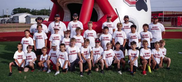 Attendees of the Kindergarten through 5th grade Cub football camp pose for a team photo. The camp for the younger athletes previews two-a-day workouts for Olney High School athletes, whose season begins in earnest in August. Photo by Will Sadler