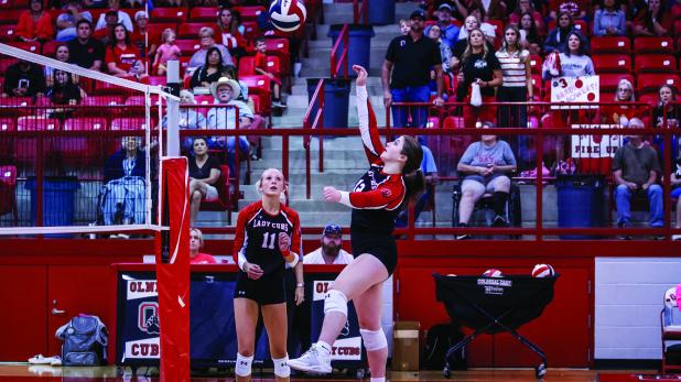 Lady Cub Senior #12 Morgan Simmons sends a volley over the net towards Ladycat defenders. Photo by Will Sadler