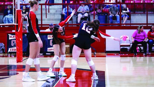 Lady Cubs #9 Oaklan Hopkins and #12 Morgan Simmons perform their new windmill high five during Senior Night. Photo by Will Sadler