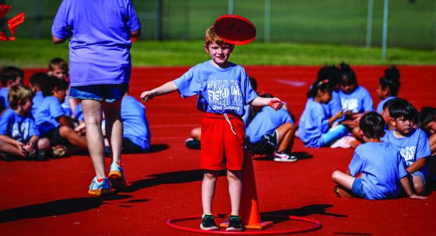 The discus competition tested coordination and athleticism during the OES field day but most of all created great memories with friends. Photo by Will Sadler