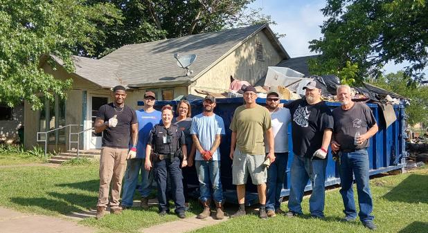 The HOME team: The Olney Police Department and the House of Mercy Enterprises (HOME) teamed up to clean up a house on West Payne as part of a code enforcement push. Photo by Gina Keating
