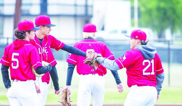 OHS Cub pitcher #11 Tucker Cortinez dabs gloves short stop #21 Ricco Sandoval at the mound before game play. Photo by Will Sadler