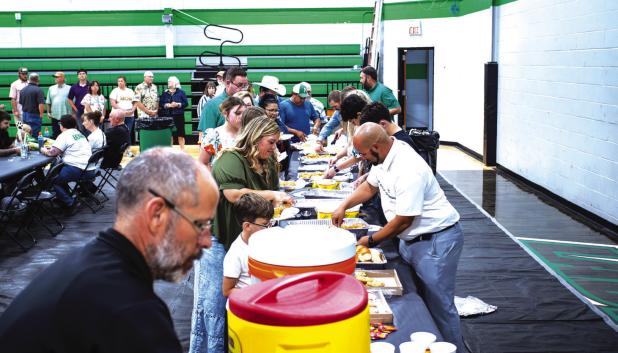 Attendees of the NHS Athletic Banquet enjoyed Chicken Express which included chicken tender veggies, a cookie and tea. Photo by Will Sadler