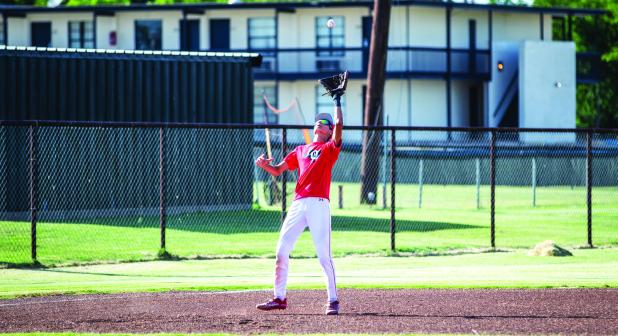 Camdon Cortinez with a pop fly out during the first match up with the Petrolia Pirates. Camdon plays alongside older brother Tucker during the summer league. Photo by Will Sadler