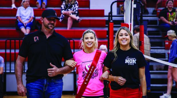 Lady Cub #3 Bradi Bowers escorted by parents Andy and Fallon Bowers during Senior Night. Photo by Will Sadler