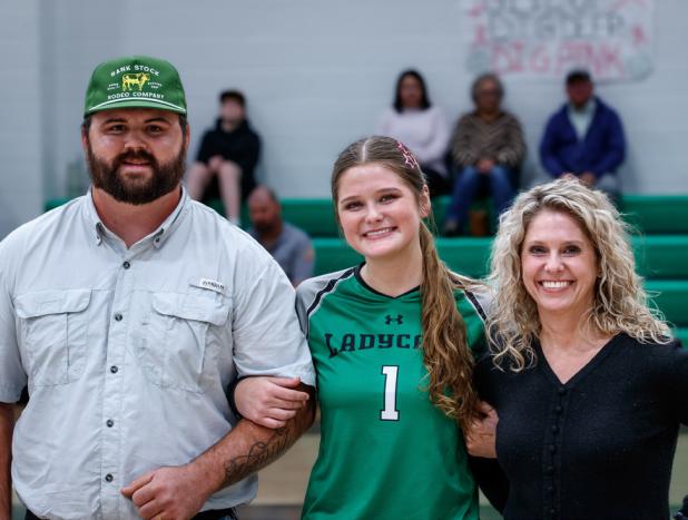 NHS Senior Ladycat Camren Mallory escorted for Senior Night recognition by Shane and Stacy Mallory.