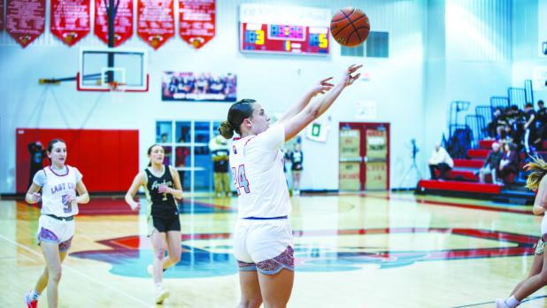 OHS Lady Cubs #24 Angel Turner sends a floater to the net during the Ladycats match up. Photo by Will Sadler