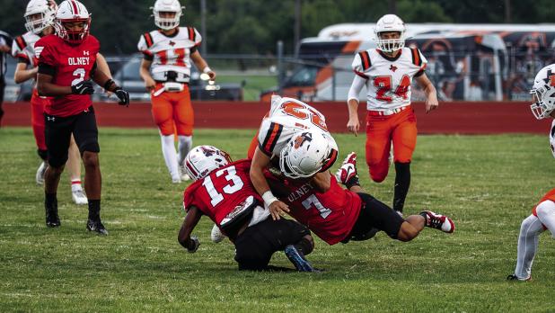 Cubs defenders #13 Reggie Williams and #7 Damian Hernandez bring down a Petrolia Pirate runner during a recent matchup. Photo by Will Sadler