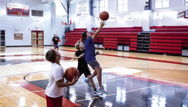 Cubs enjoyed fun competition during the basketball summer camp, shown practicing a layu Photo by Will Sadler