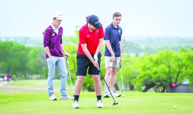 OHS Cub Colby Johnson was laser focused while making this putt during district play. Photo by Will Sadler