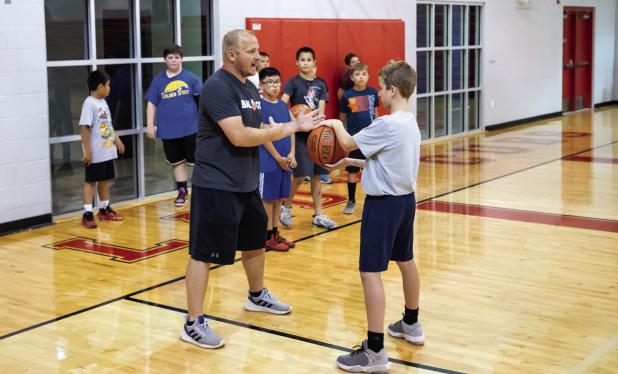 New basketball coach hosts