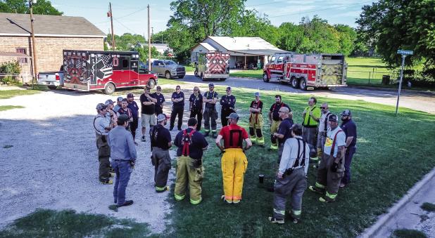 Firefighter Dustin Hudson led smoke training for the Olney Volunteer Fire Department that included multiple City of Olney departments. Here, Hudson gives safety instructions and the agenda for the day’s activities on May 30. Photo by Will Sadler
